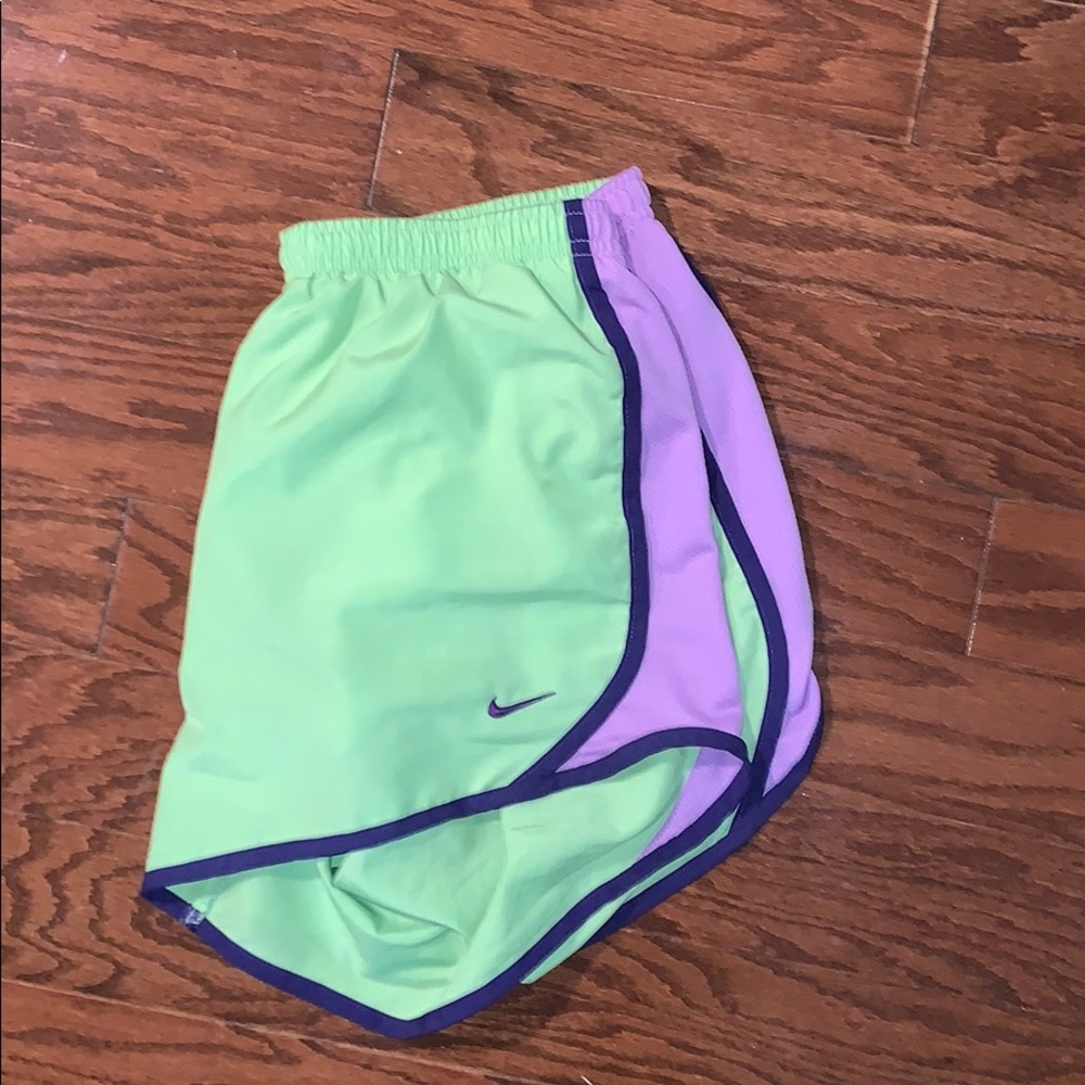 green & purple Nike shorts